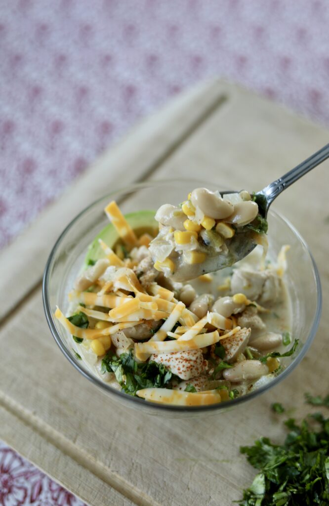 white chicken chili on spoon